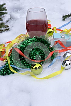 Hot mulled wine in the snow with Christmas decorations