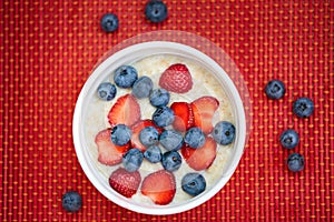 Hot oatmeal breakfast with fresh fruits