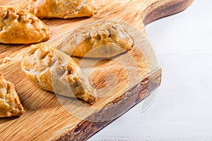 Hot pasties from butter enriched puff pastry filled with minced