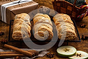 Hot pastry, apple strudel on a lattice, New Year and Christmas, traditions and gifts, rustic style