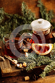 hot pink tea with cinnamon in a transparent mug, rustic style