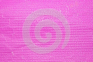 Hot pink textured packaging paper closeup