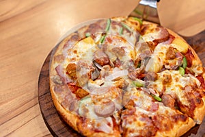 Hot pizza dip tray of pizza toppings include ham, pork, paprika and vegetables, pizza, Italian food saurian. View from side