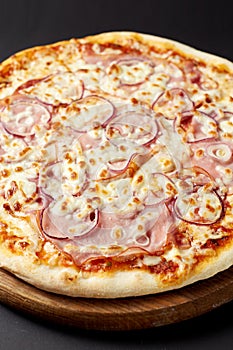 Hot pizza Meat on a rustic wooden table.