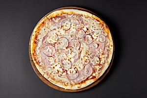 Hot pizza Meat on a rustic wooden table.