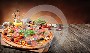 Hot Pizza Served On Old Table