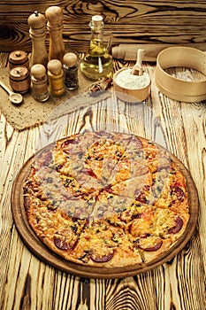 Hot pizza slice with melting cheese on a rustic wooden table.pepperoni pizza,Hot Homemade Pepperoni Pizza Ready to Eat,Supreme Pi
