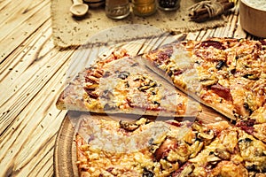 Hot pizza slice with melting cheese on a rustic wooden table.pepperoni pizza,Hot Homemade Pepperoni Pizza Ready to Eat,Supreme Pi