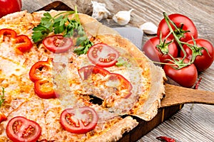 Hot pizza on wooden background