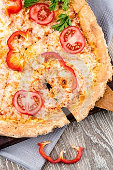 Hot pizza on wooden background