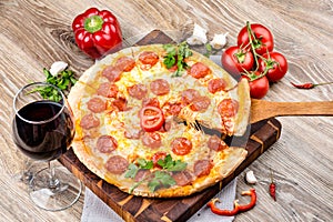 Hot pizza on wooden background