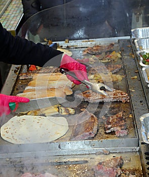 hot plate of a Street Food food stand with piadina and sausages