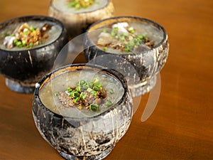 Hot porridge in a coconut shell bowl