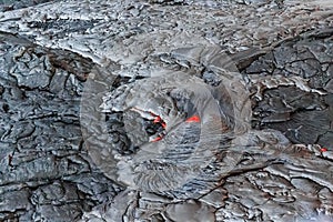 Hot red lava turns black and gray after it cools