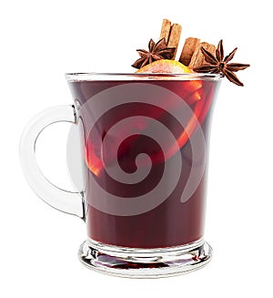 Hot red mulled wine in glass isolated on white background. Mulled wine with christmas spices, orange slice, anise and cinnamon