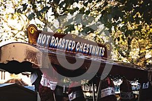 A hot roasted chestnut stall with sign