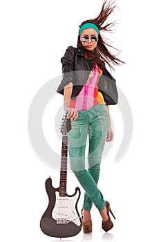 Hot rock and roll woman with electric guitar