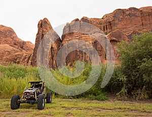 A hot rod parked in the desert