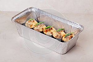 Hot roll sushi with an aluminum cap in the form