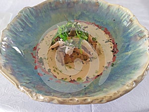 Hot salad wirh shrimps in a dish photo