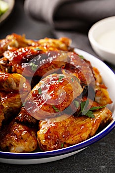 Hot sauce glazed chicken wings, roasted or fried