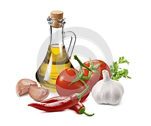 Hot sauce ingredients, tomato, garlic, onion, chili pepper and olive oil in bottle isolated on white background