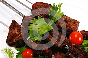 Hot shish kebab on skewer photo