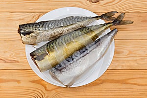 Hot-smoked, cold-smoked and salted mackerels on a dish