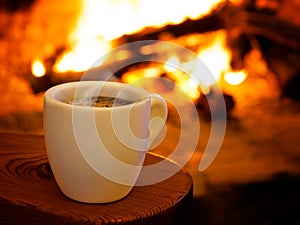 Hot smoking coffee by fireplace