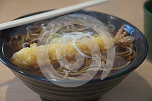 Hot Soba with Tempura - Japanese ramen noodle with shrimps tempura in a bowl