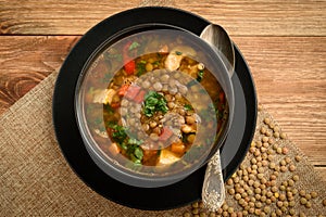 Hot soup with green lentil, chicken, vegetables and spices.