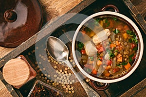 Hot soup with green lentil, chicken, vegetables and spices.