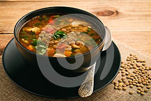 Hot soup with green lentil, chicken, vegetables and spices.