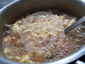 Hot and sour soup with vegetables and chicken