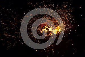 Hot sparking live-coals burning in a barbecue