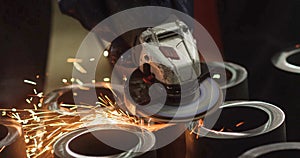 Hot sparks flying in the air from a metal grinder