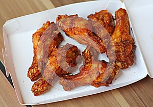 Hot and Spicey Buffalo Chicken Wings in cardboard delivery box photo