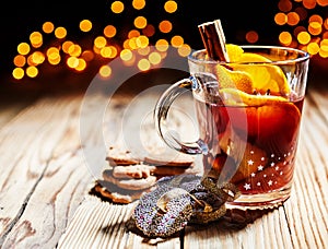 Hot spicy Christmas gluhwein served with cookies photo