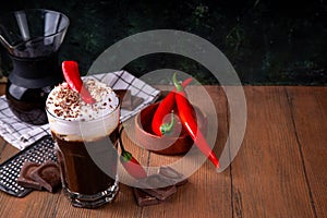 Hot spicy coffee latte with chili pepper