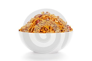 Hot spicy Nav Ratan snacks in a white Ceramic bowl, made with red chili, peanuts, corn flakes