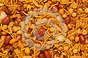 Hot spicy NavRatan mixture snacks in full-frame, made with, potato chips, peanuts,