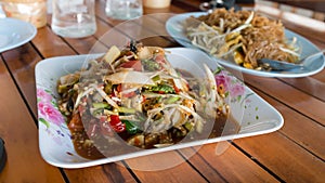 Hot and spicy papaya salad with pad thai, Thai style