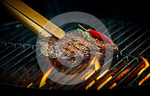 Hot spicy rump steak on a summer barbecue photo