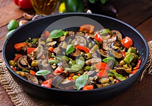 Hot spicy stew eggplant, sweet pepper, olives and capers.