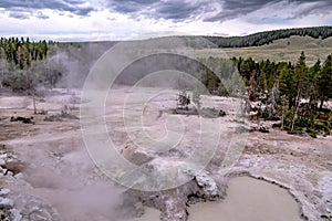 Hot spring and geiser in yellowstone national par photo