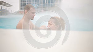 Hot spring geothermal spa. Romantic couple in love relaxing in hot pool.