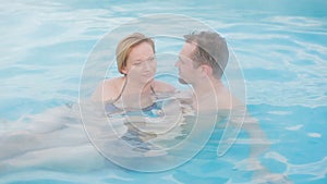 Hot spring geothermal spa. Romantic couple in love relaxing in hot pool.