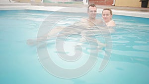 Hot spring geothermal spa. Romantic couple in love relaxing in hot pool.