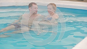 Hot spring geothermal spa. Romantic couple in love relaxing in hot pool.