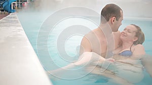 Hot spring geothermal spa. Romantic couple in love relaxing in hot pool.